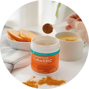 Turmeric Superfood Powder Scooping PNG Image