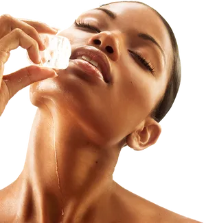 Woman_ Applying_ Facial_ Ice_ Treatment PNG Image