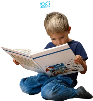 Young Boy Engrossedin Reading PNG Image